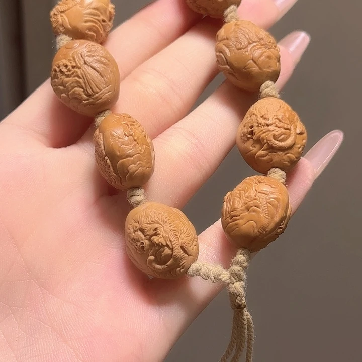 掩***.手串橄榄核虎啸山林