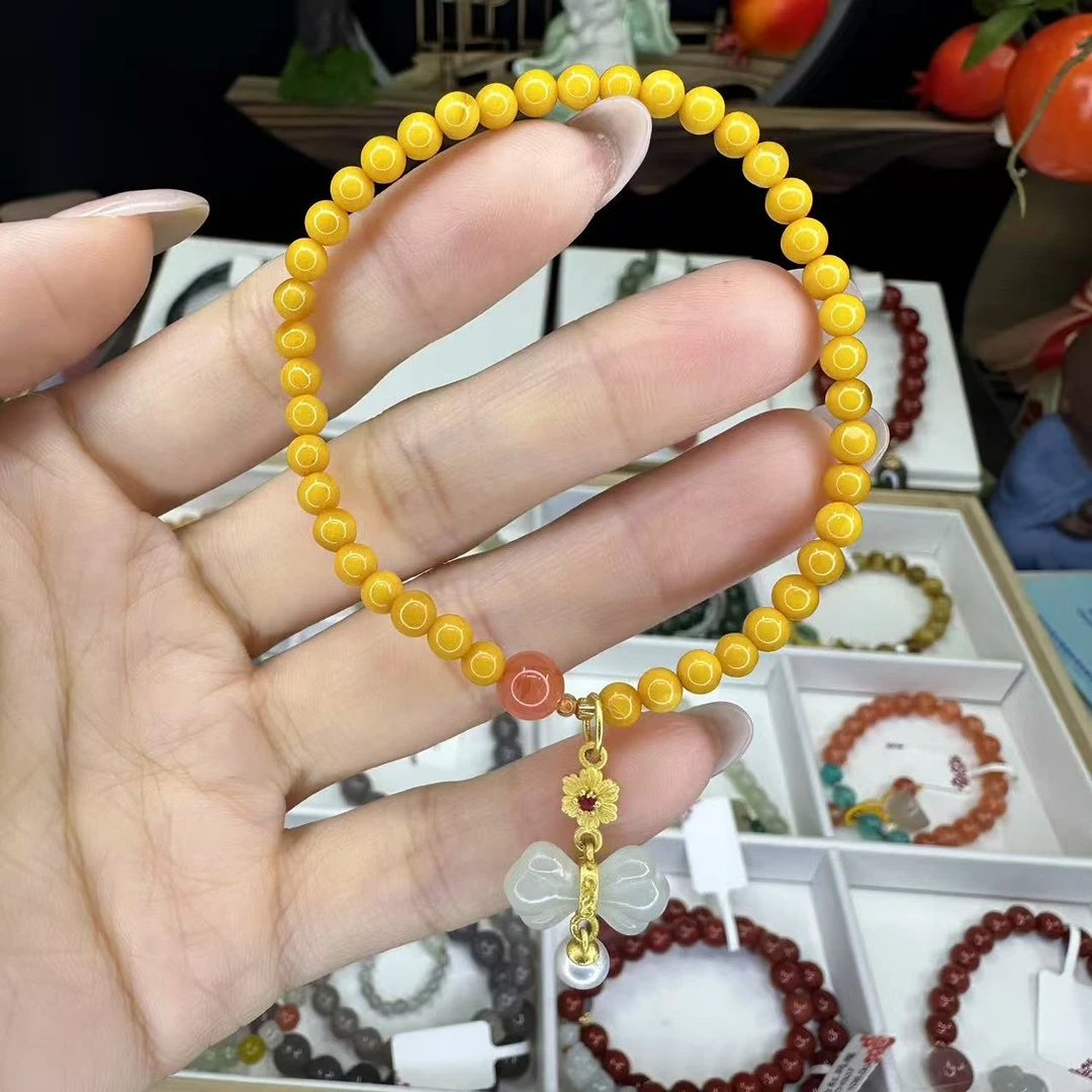 （新年好礼）天然蜜蜡和田玉蝴蝶结吊坠手串7558