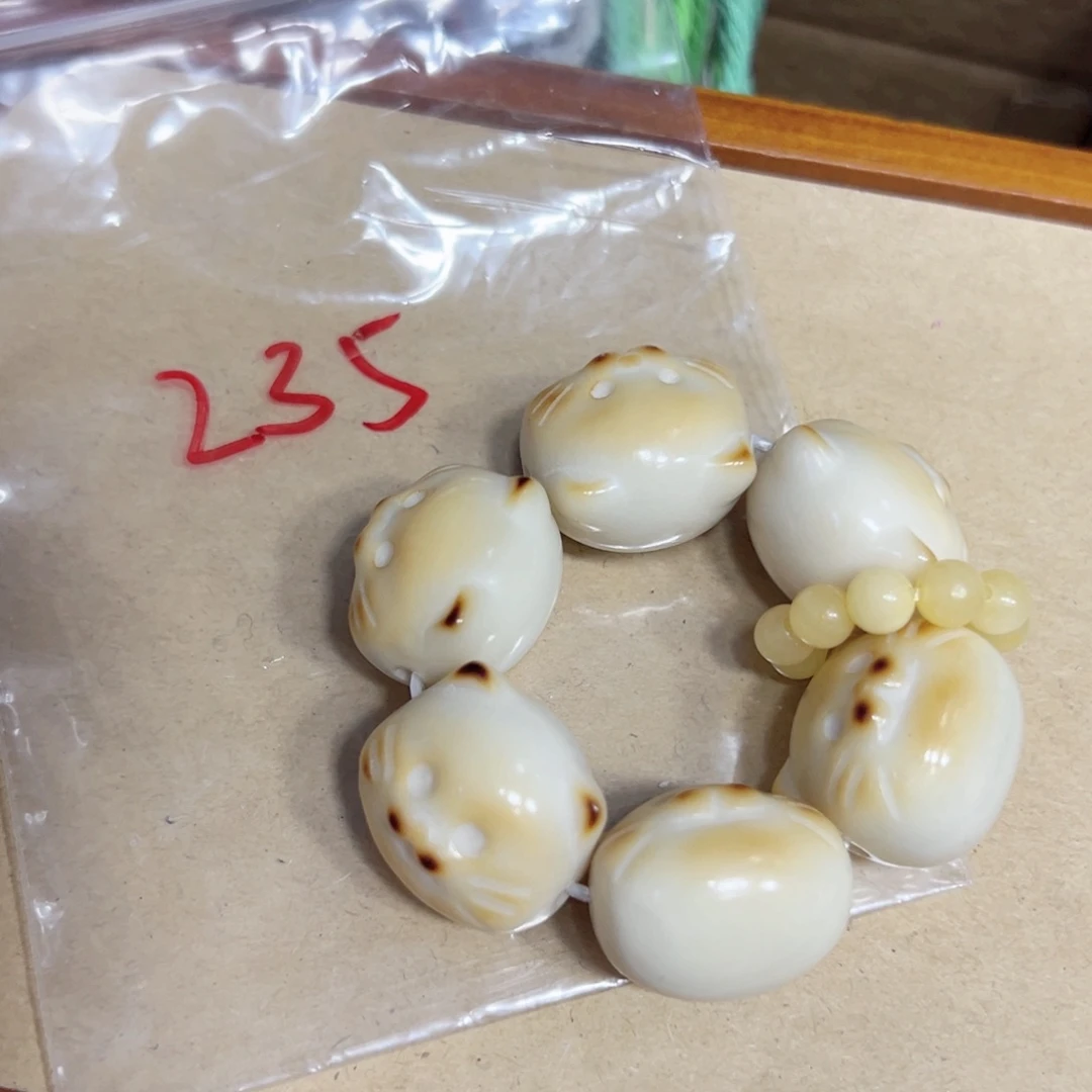 是***啊235 海报猫 象牙果手捻子卡25左右