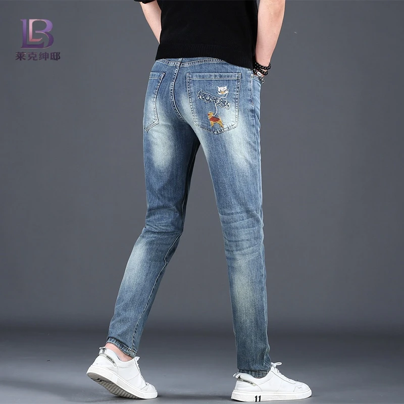 男士潮牌刺绣印花牛仔裤男款修身小脚夏季新款高端韩版休闲长裤子