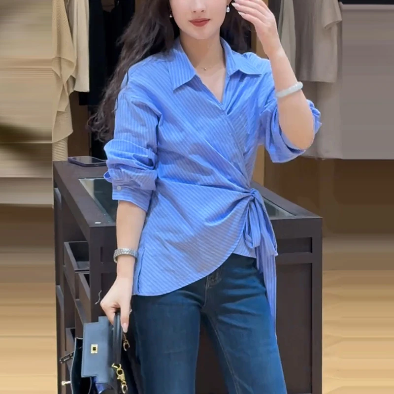 蓝色气质长袖POLO领条纹衬衫女早季新款收腰显瘦上衣不规则衬衣