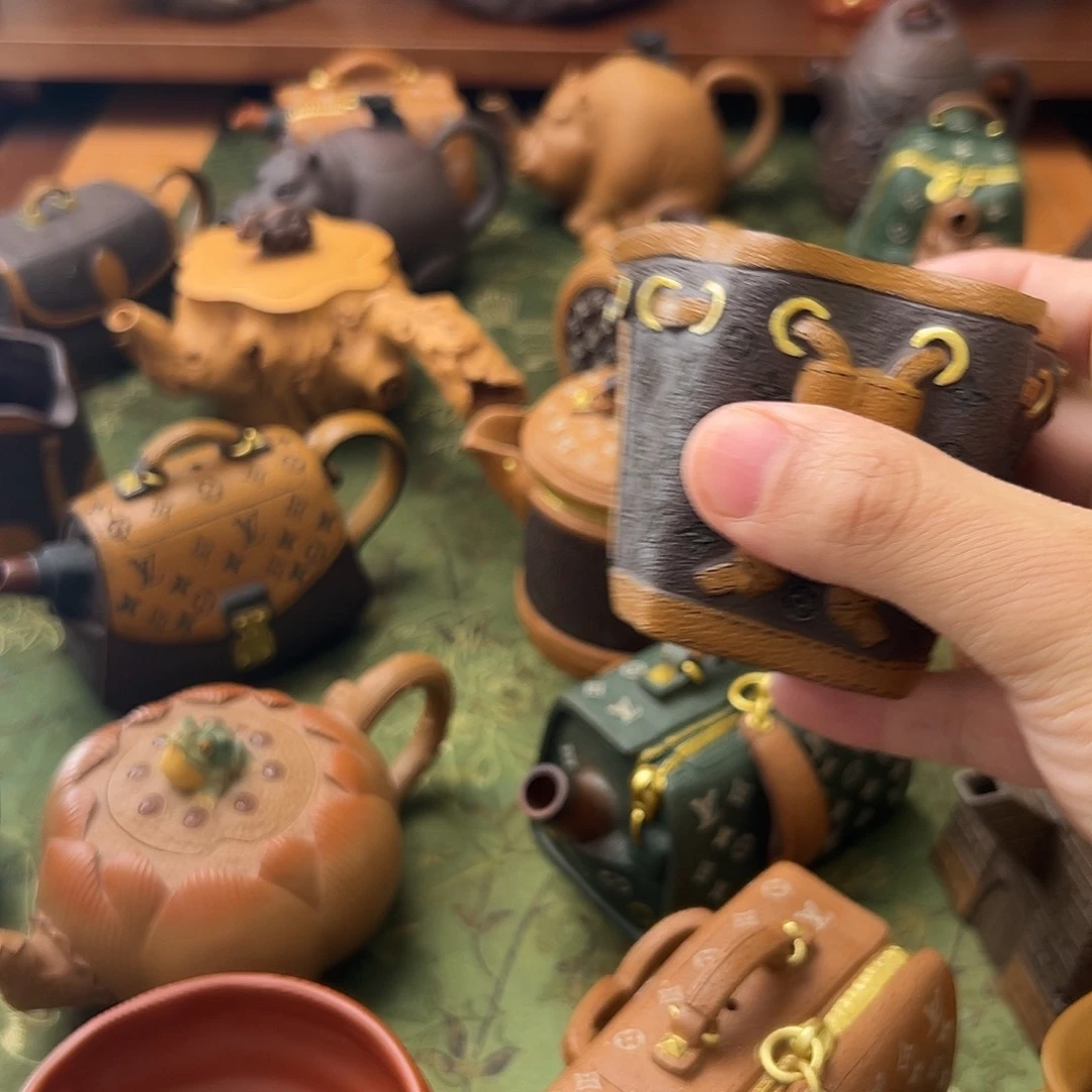 茶壶紫砂包包杯垫都不舍得