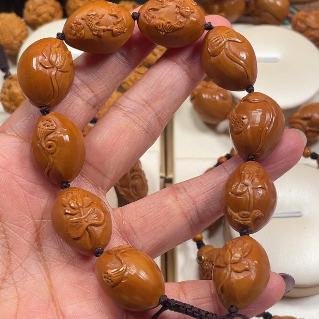 萨****橄榄核手串/手链荷花鲤鱼橄榄核手串微上色