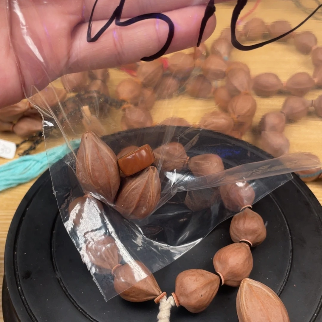 巧***儿橄榄核吊坠四花20补子两颗巧儿