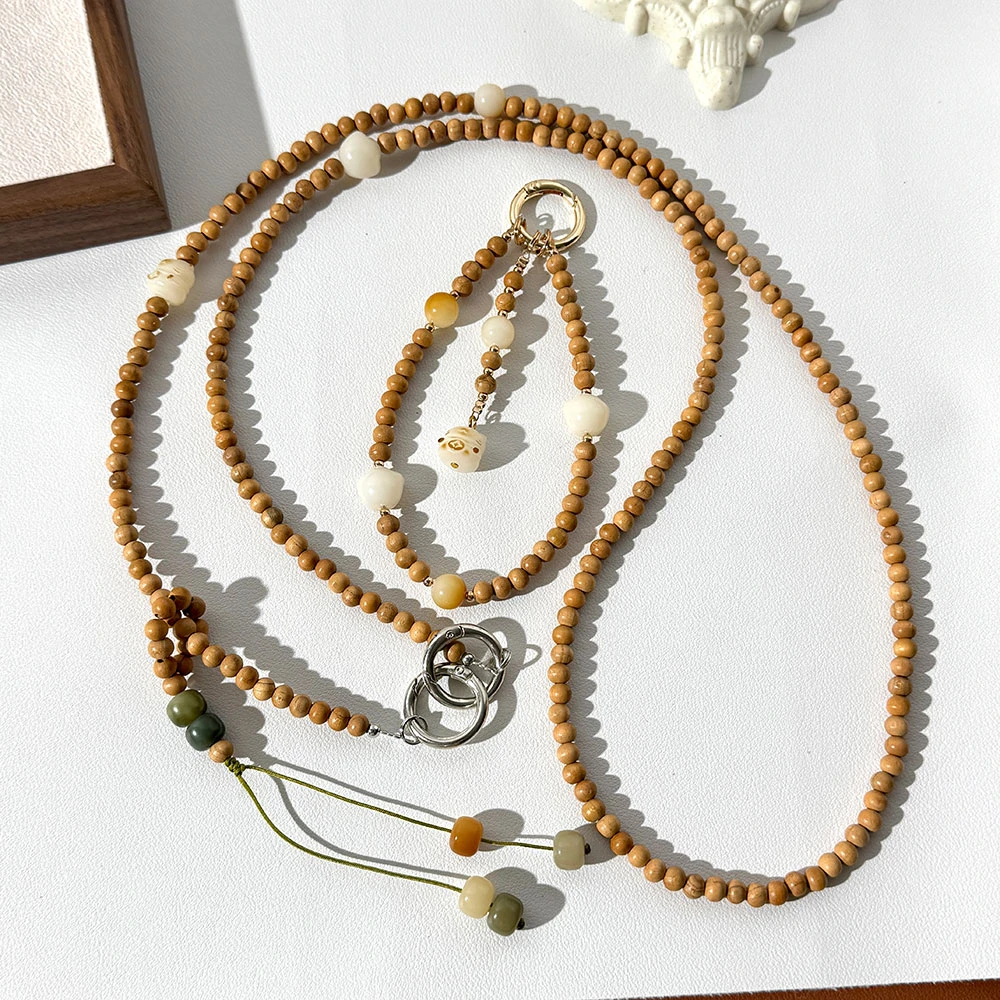 新款小众手机链斜跨菩提猫爪串珠挂件防丢桃木手机手腕绳挂饰