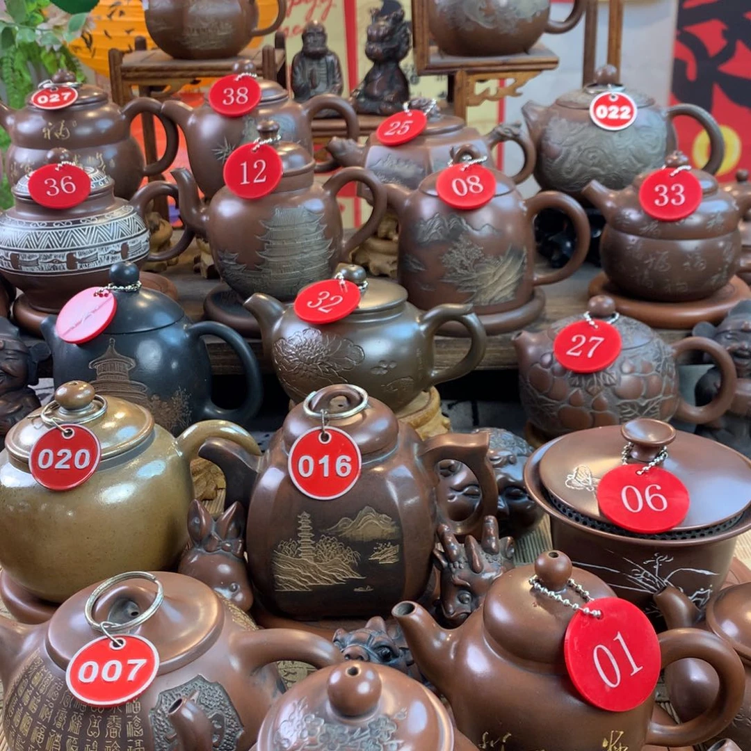 玉**业坭兴陶手工刻绘壶