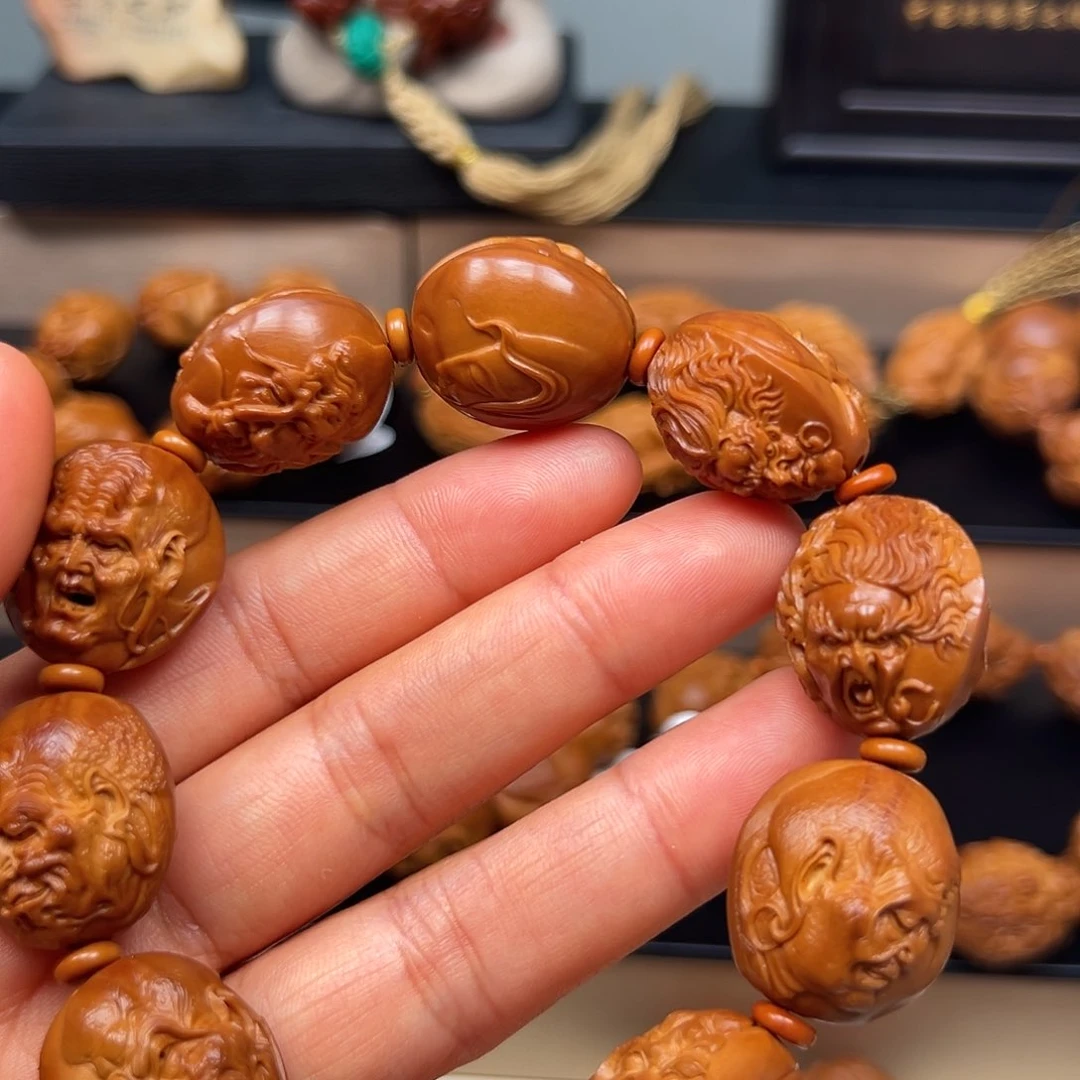 橄榄核吊坠罗汉手串