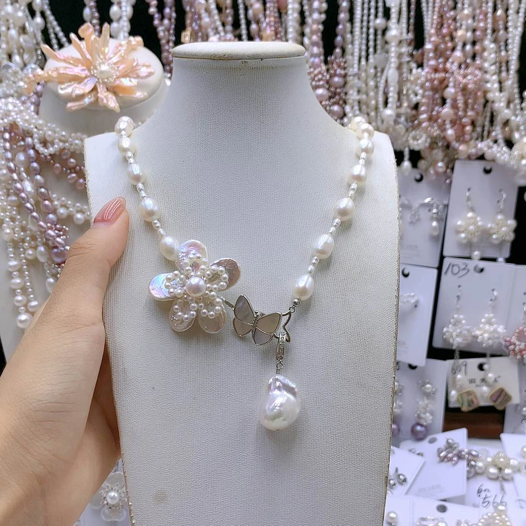 银S925镶嵌耳饰淡水珍珠妮****》