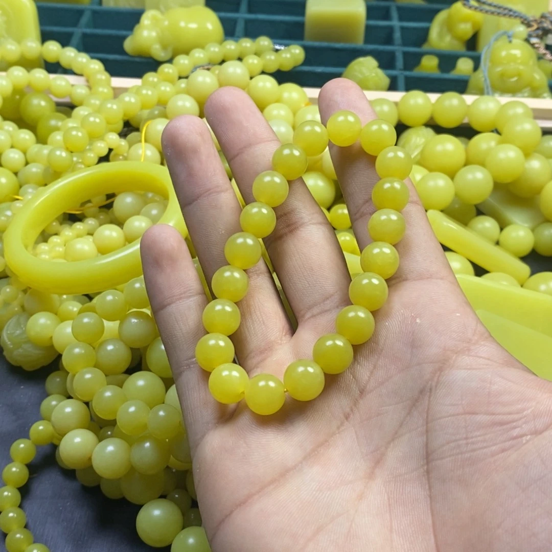 慈***心非金属卡12手串鸡油黄