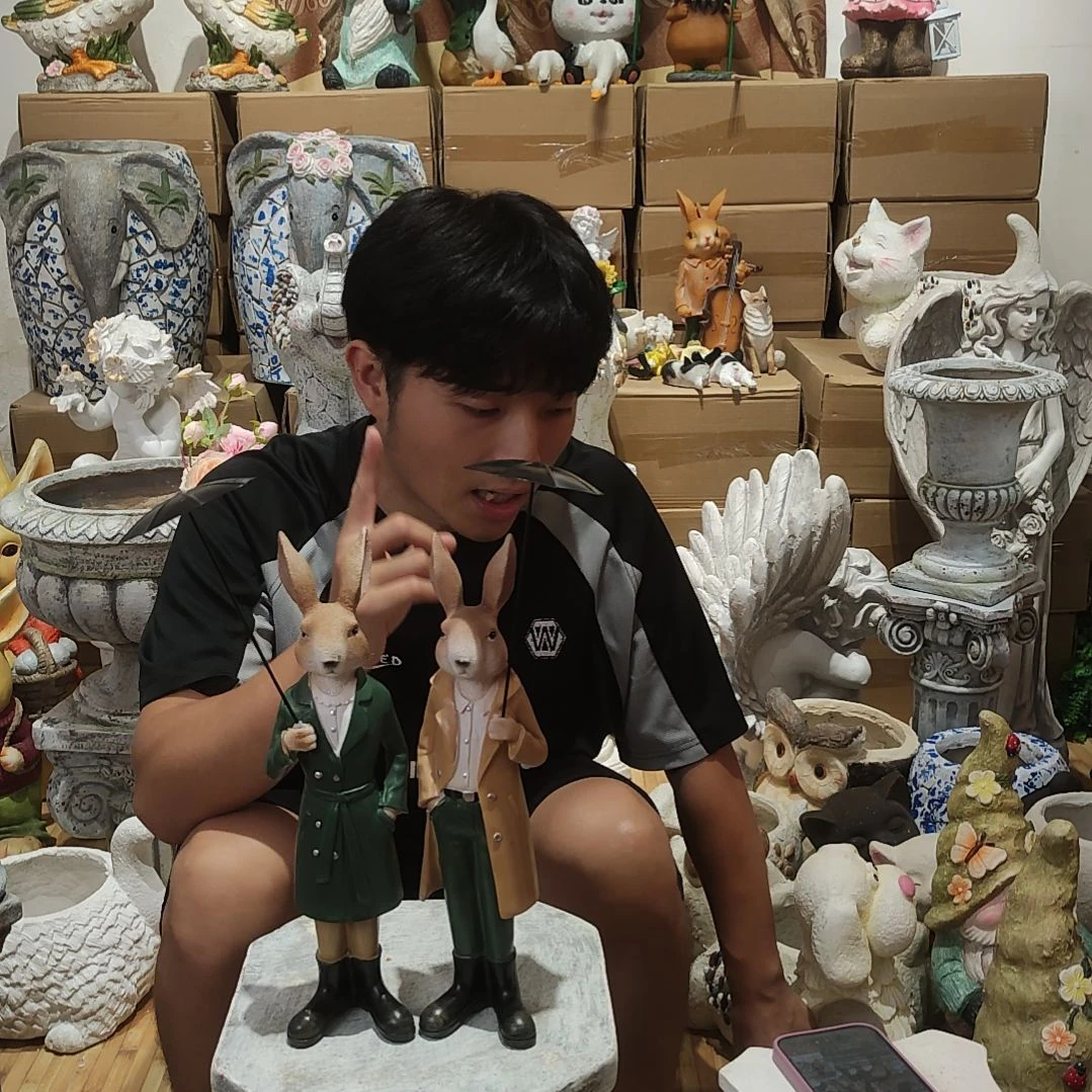 合成树脂打伞兔子一对