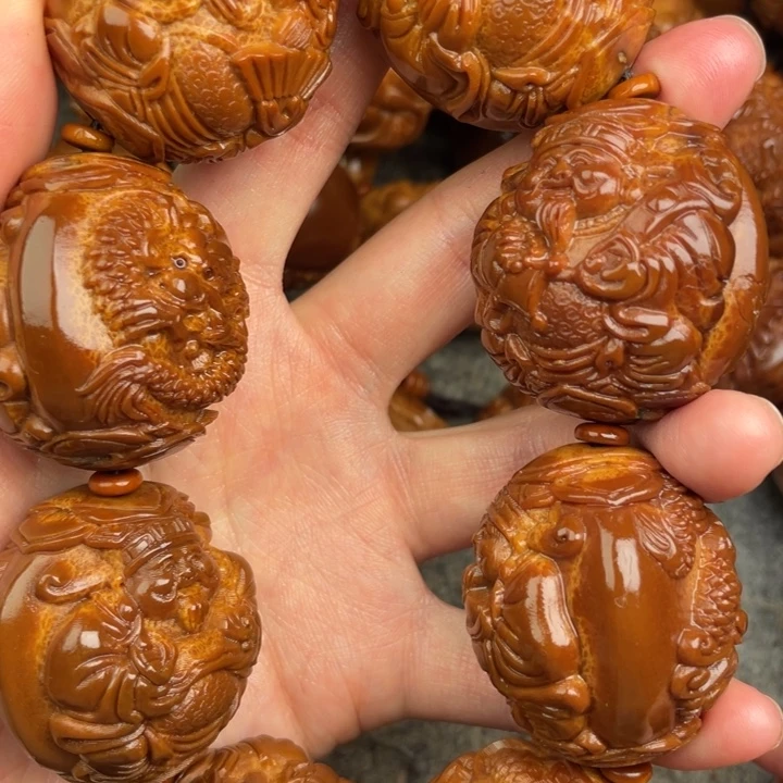 北***孩橄榄核吊坠橄榄核