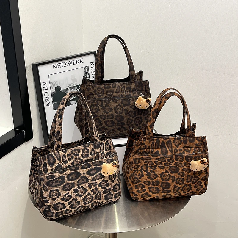 新款小众豹纹拉链外侧兜帆布包手提包多口袋妈咪包卡通便携饭盒包