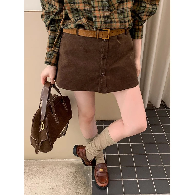 美拉德咖色灯芯绒a字半身裙女秋冬季2025新款小个子排扣包臀短裙