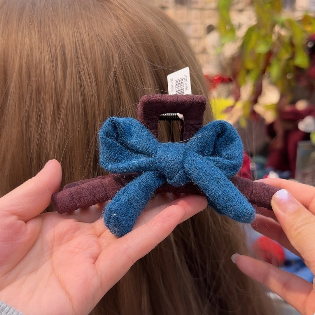 皮质非金属蓝色蝴蝶结抓夹