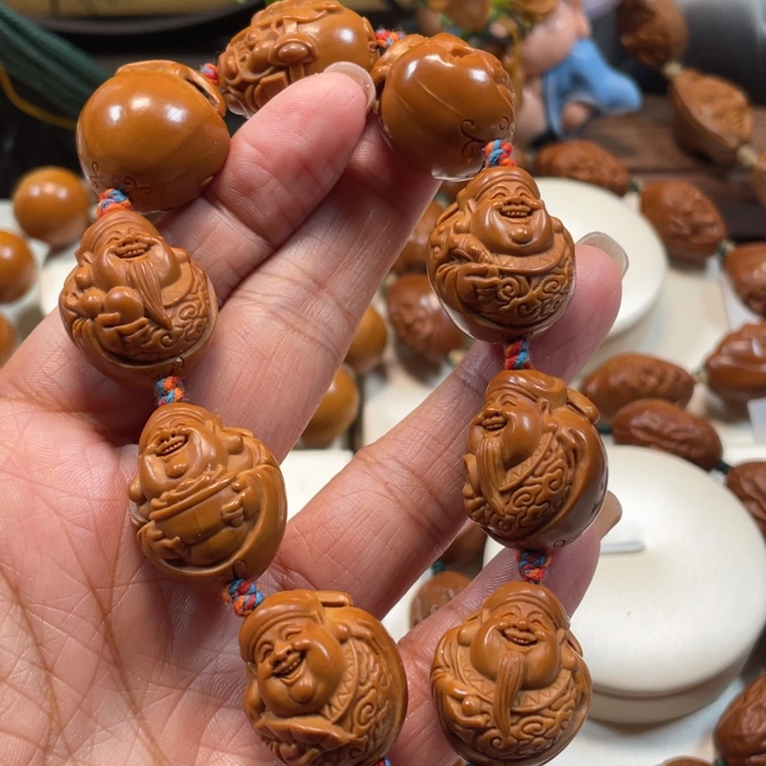 靠***6地主财神橄榄核手串