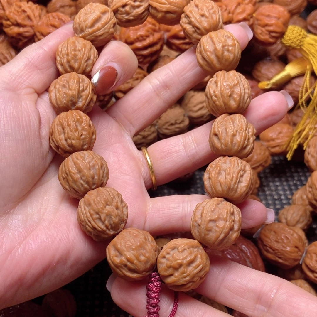 手***i桃核吊坠野生树王手串