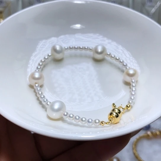 淡水珍珠银S925镶嵌耳饰