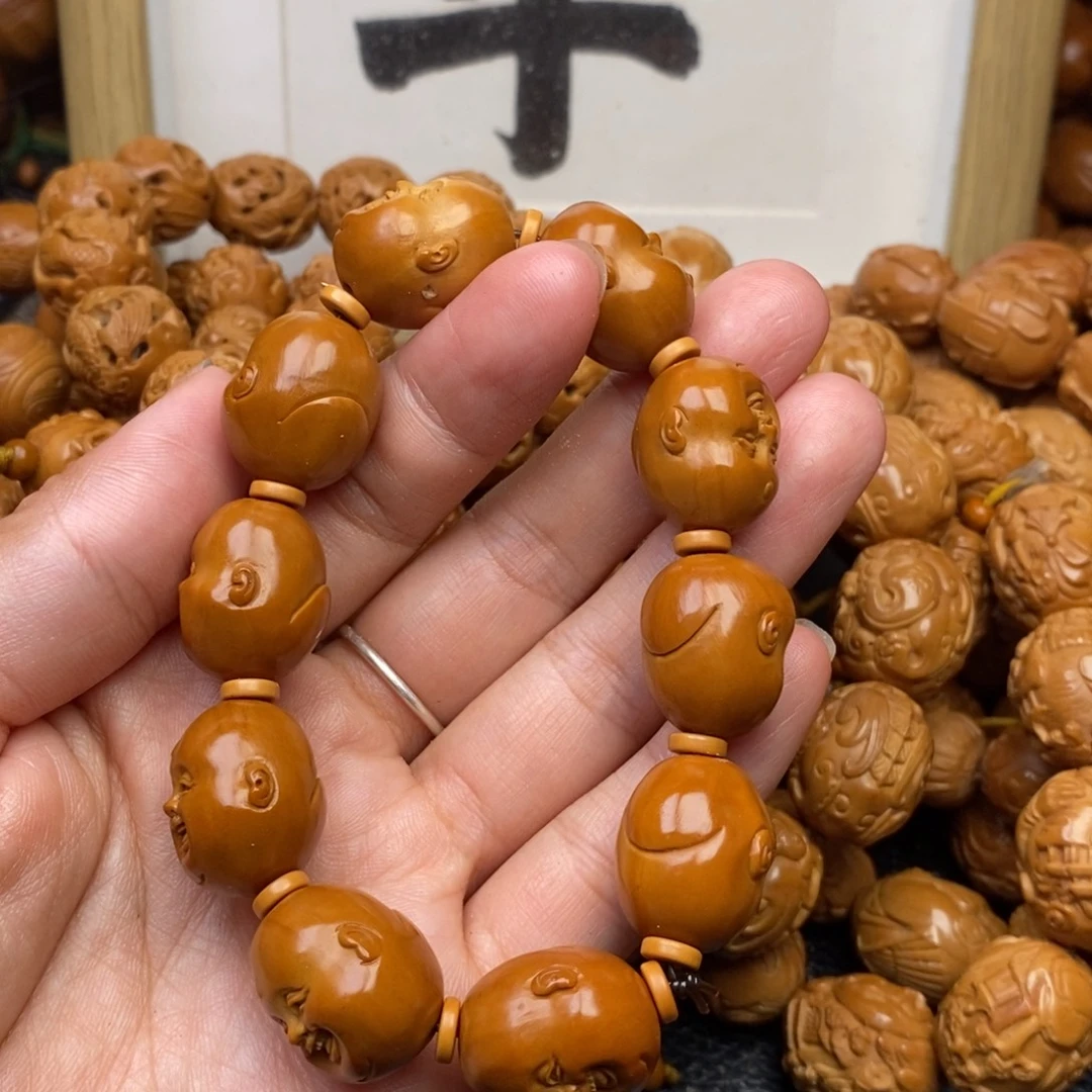 爱***饰手串橄榄核十分开心