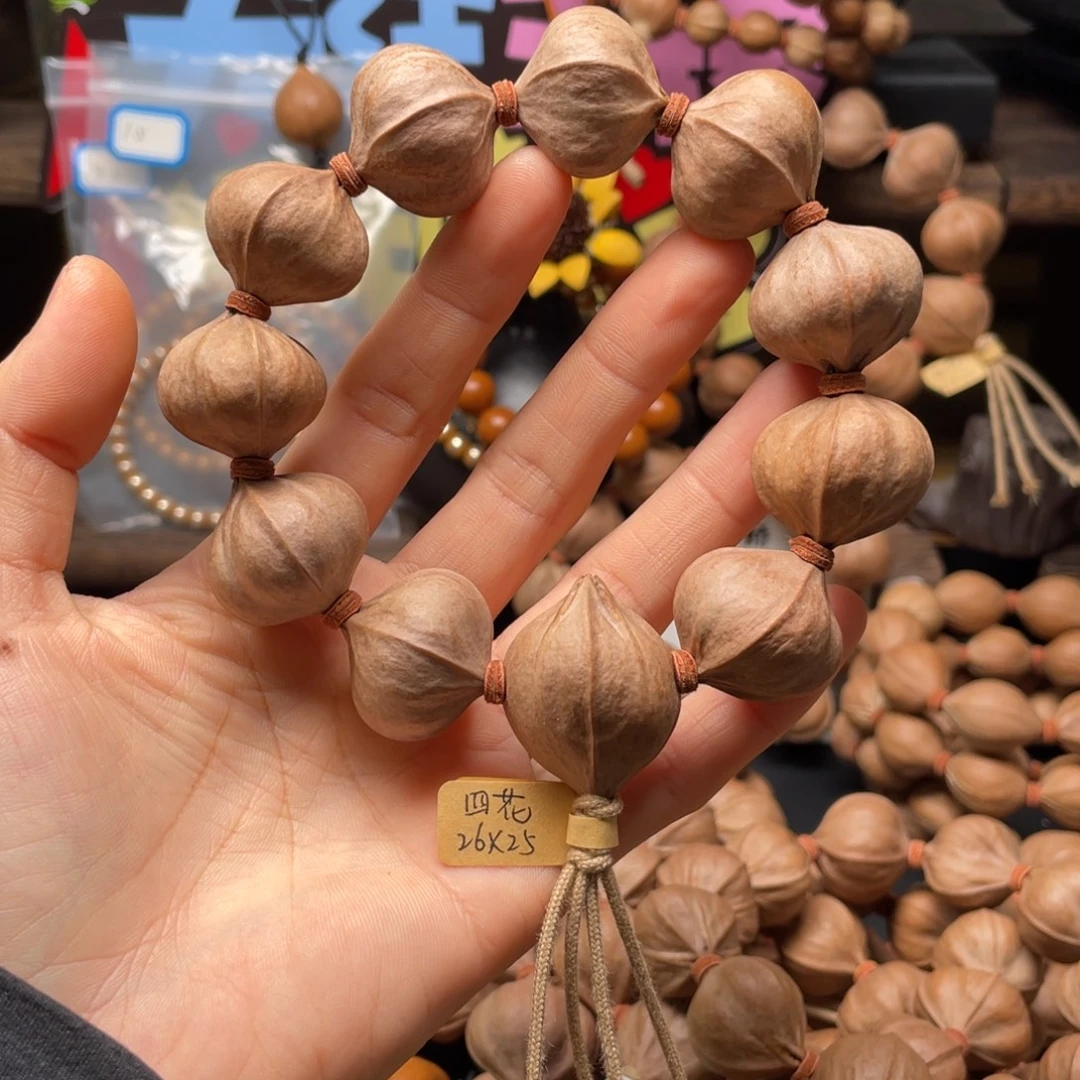 姜***牙吊坠橄榄核2625四花铁核