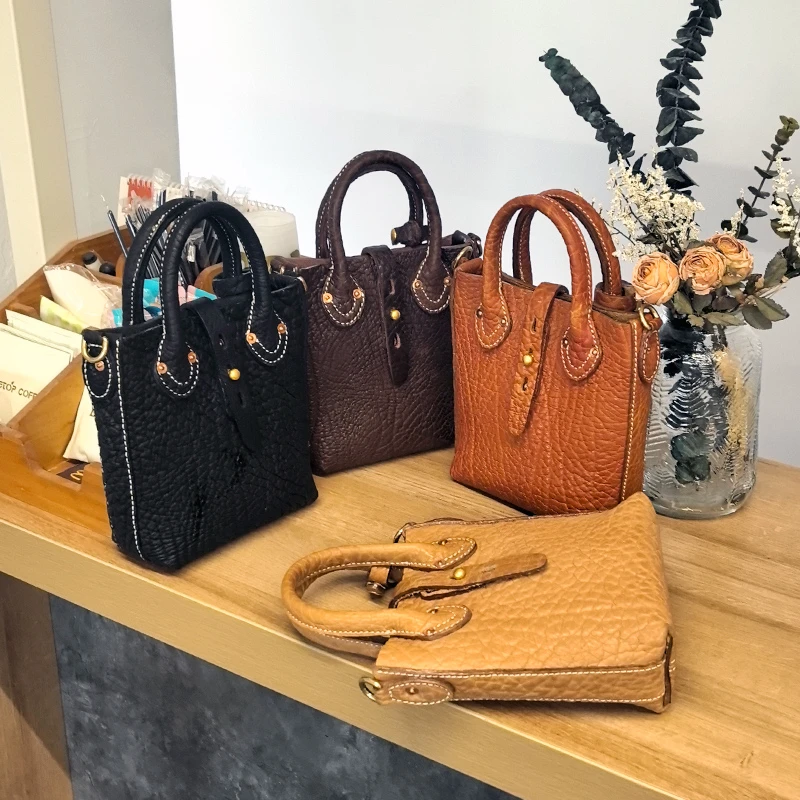 牛颈纹牛皮经典水桶简约女士便携时尚出门万能小包真皮女包水桶包