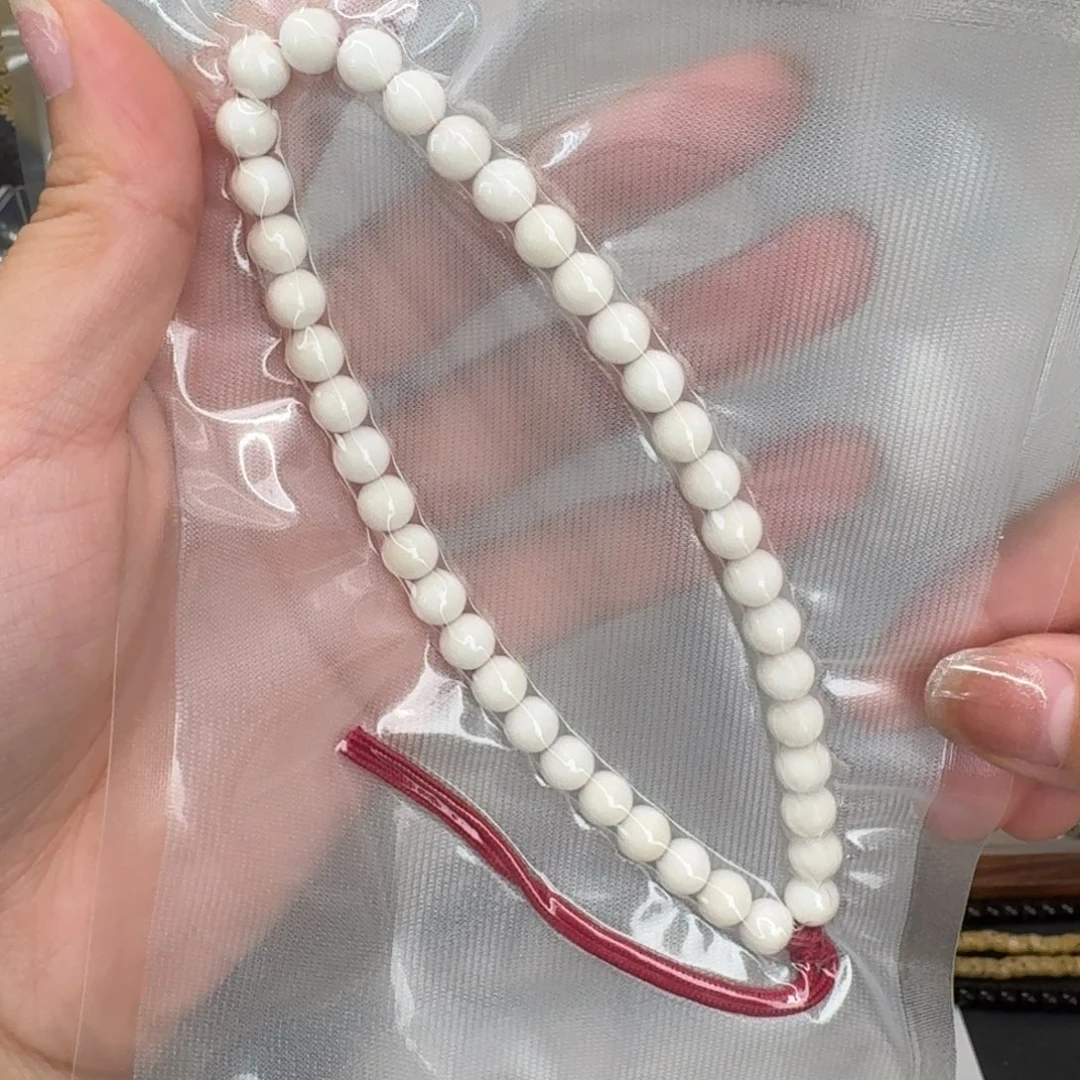 白玉菩提吊坠7圆手持