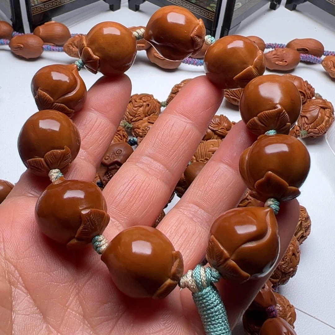 手串/手链橄榄核涅**。寿桃手串
