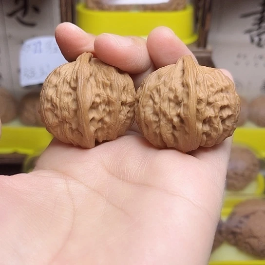 文玩核桃吊坠虎头半璧