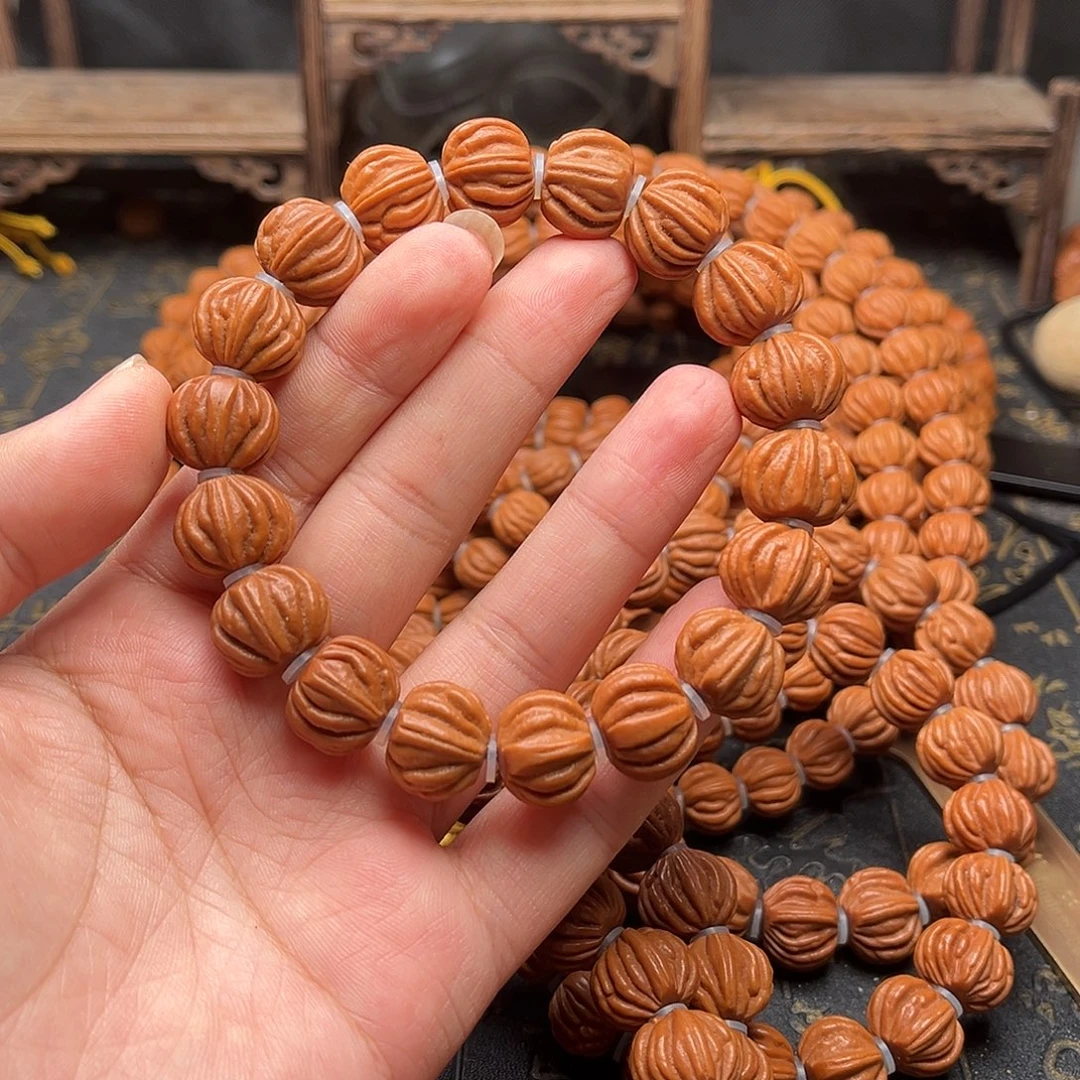 桃核吊坠佛手手串