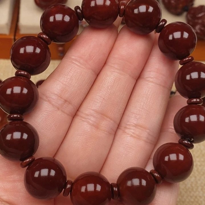 蒙***飞橄榄核吊坠正圆光珠