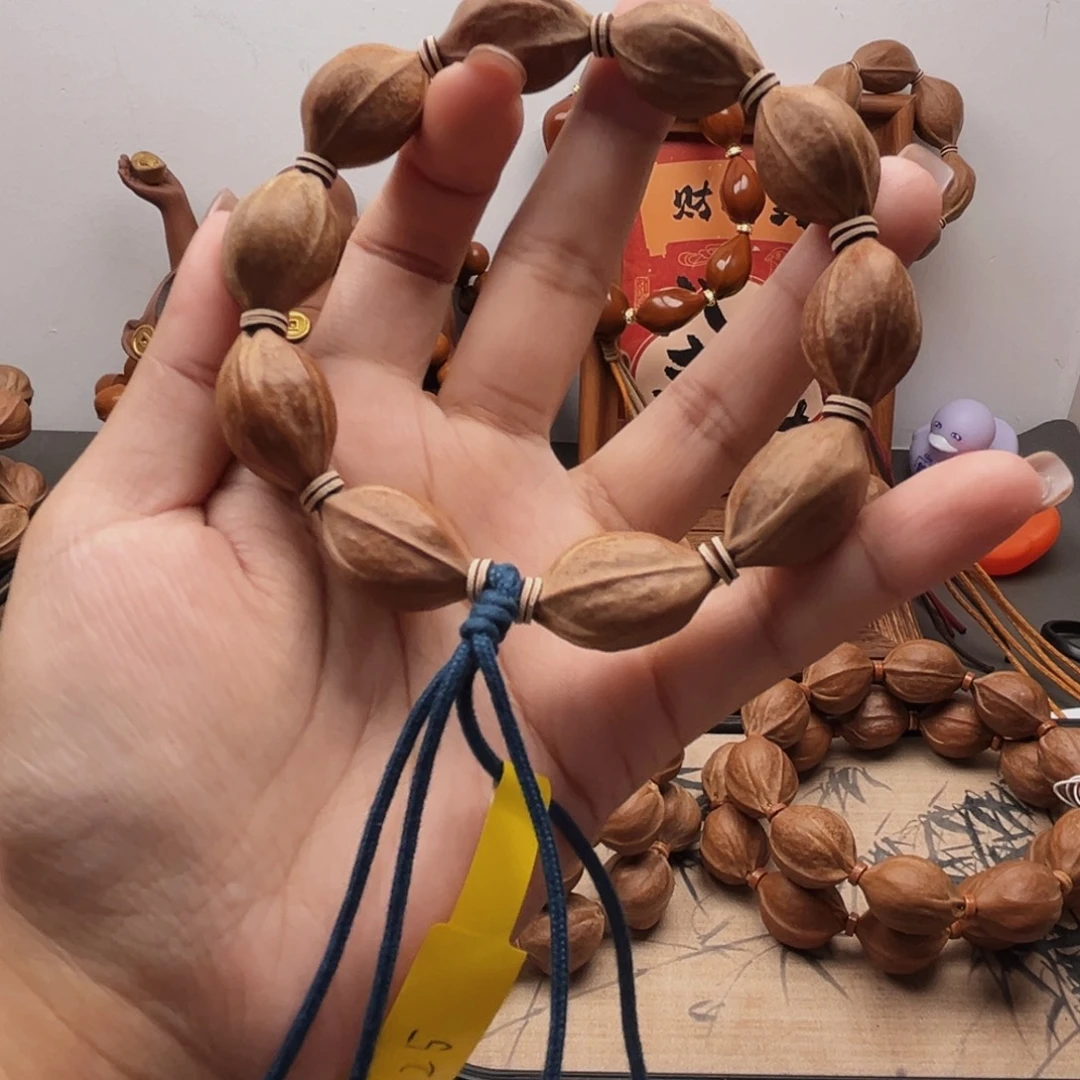 伍***阳手串橄榄核16.25梅林铁核