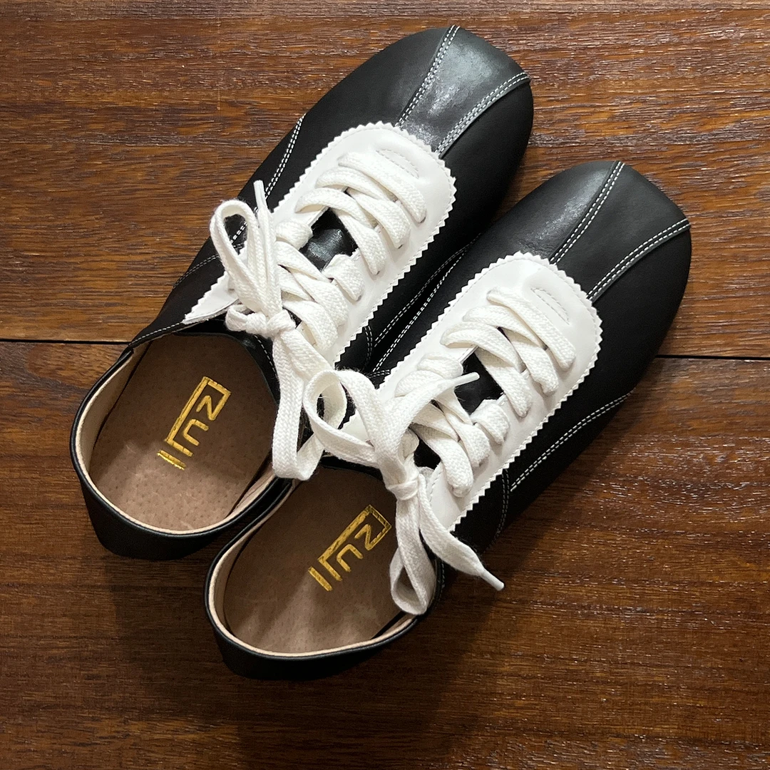 林印象黑色牛皮德训鞋女2025秋款复古平底休闲运动板鞋阿甘女鞋