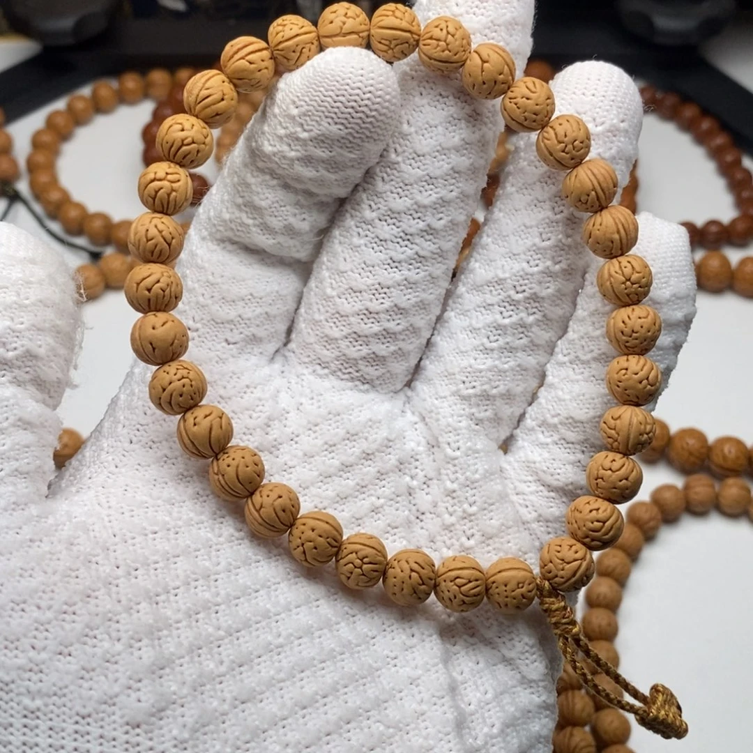 贝***呀桃核吊坠源系列桃核手持