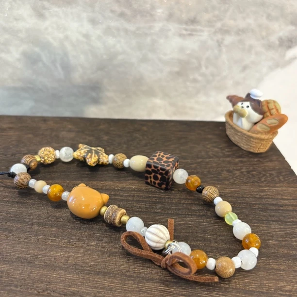 kt蝴蝶结手机链SJL016