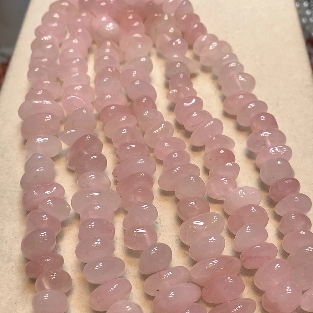 玛瑙/玉髓未镶嵌珠宝半成品天然胖粉晶中孔一条