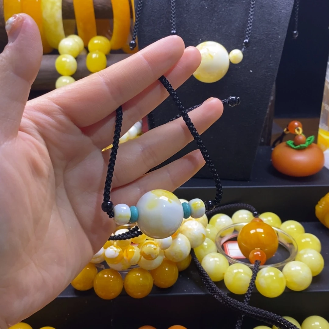 —***。非金属瓷白金花单珠锁骨链