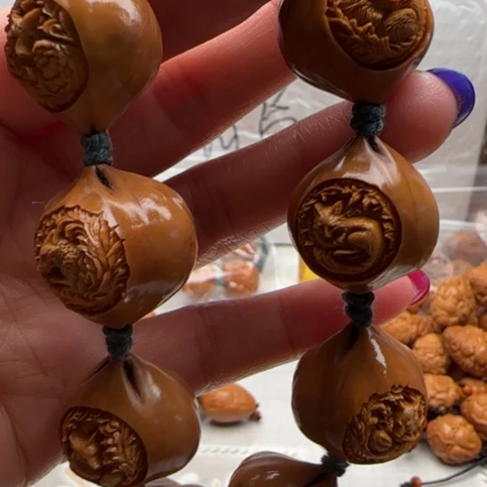 奈***可手串橄榄核橄榄雕工艺品
