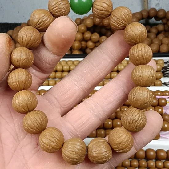 桃核吊坠猴头手串风羽