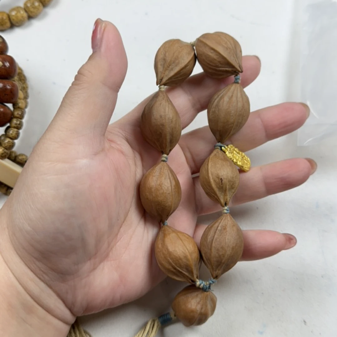 1.8cm*2.6cm梅林铁头核原皮橄榄核雕