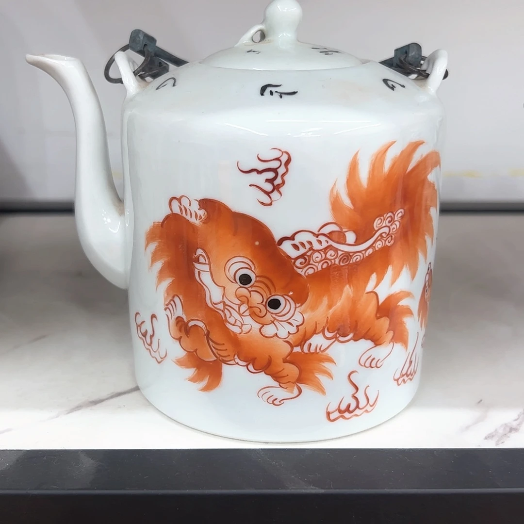 罐「****狮子提梁壶一把