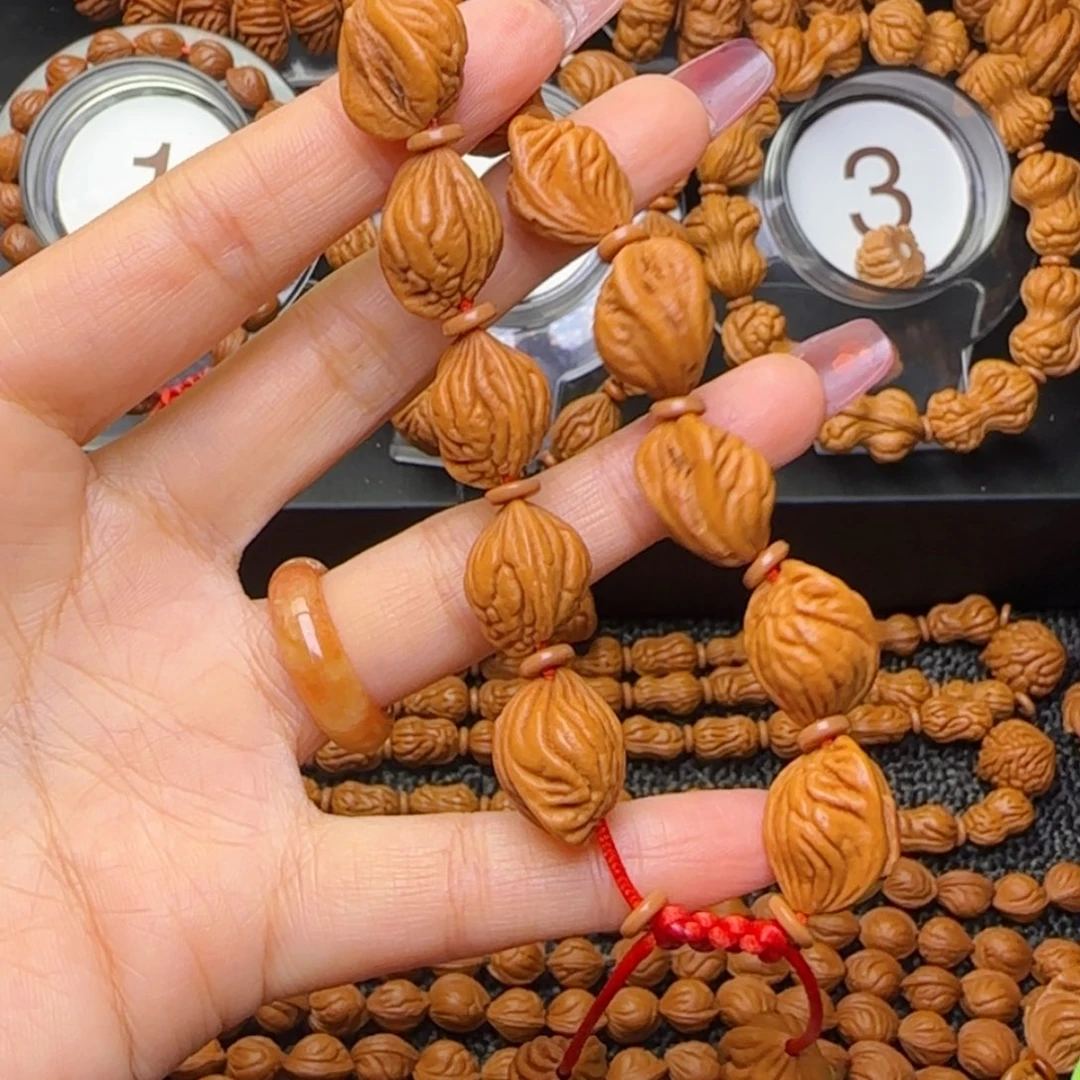 J***i桃核吊坠生命之源手串