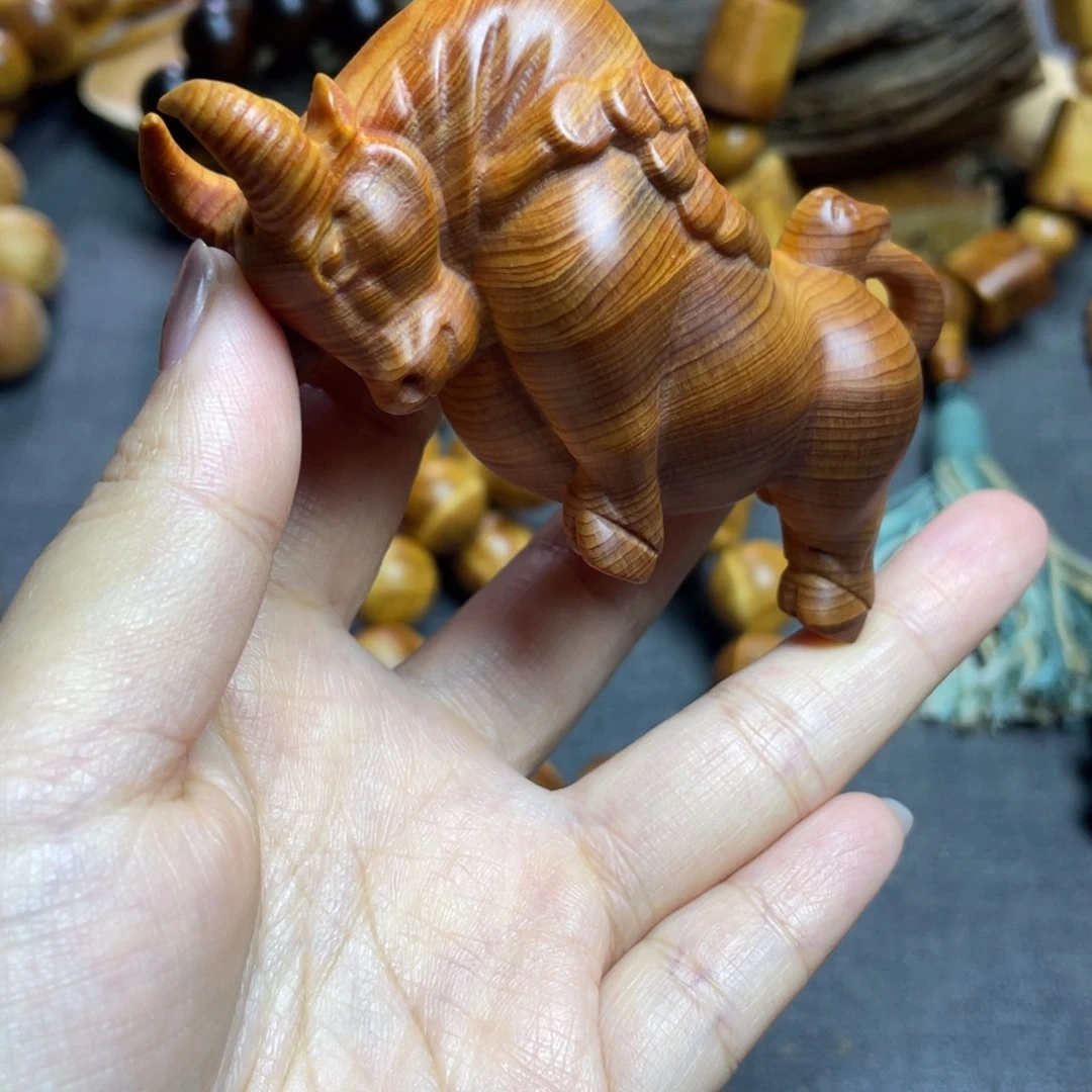 云***雨柏木（崖柏）手把件牛起冲天