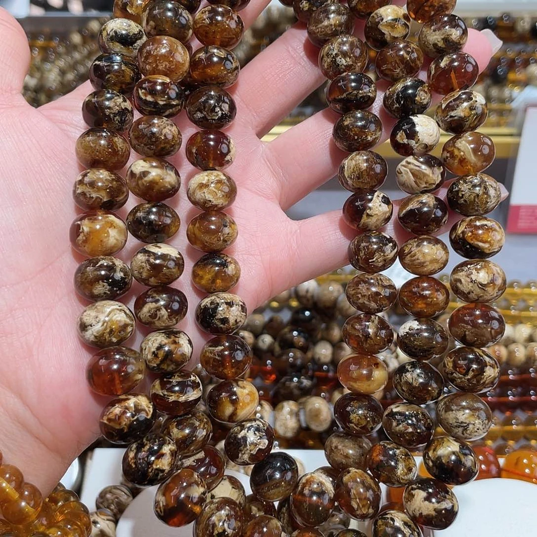 闹***闹琥珀未镶嵌颈饰12m溶洞