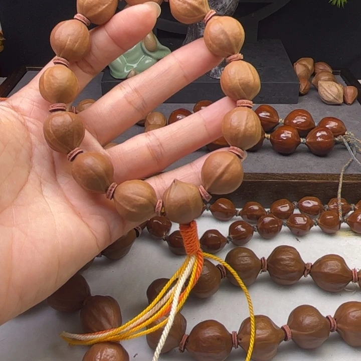 微***。手串/手链橄榄核1.6*1.9原皮三花带三通铁核树王