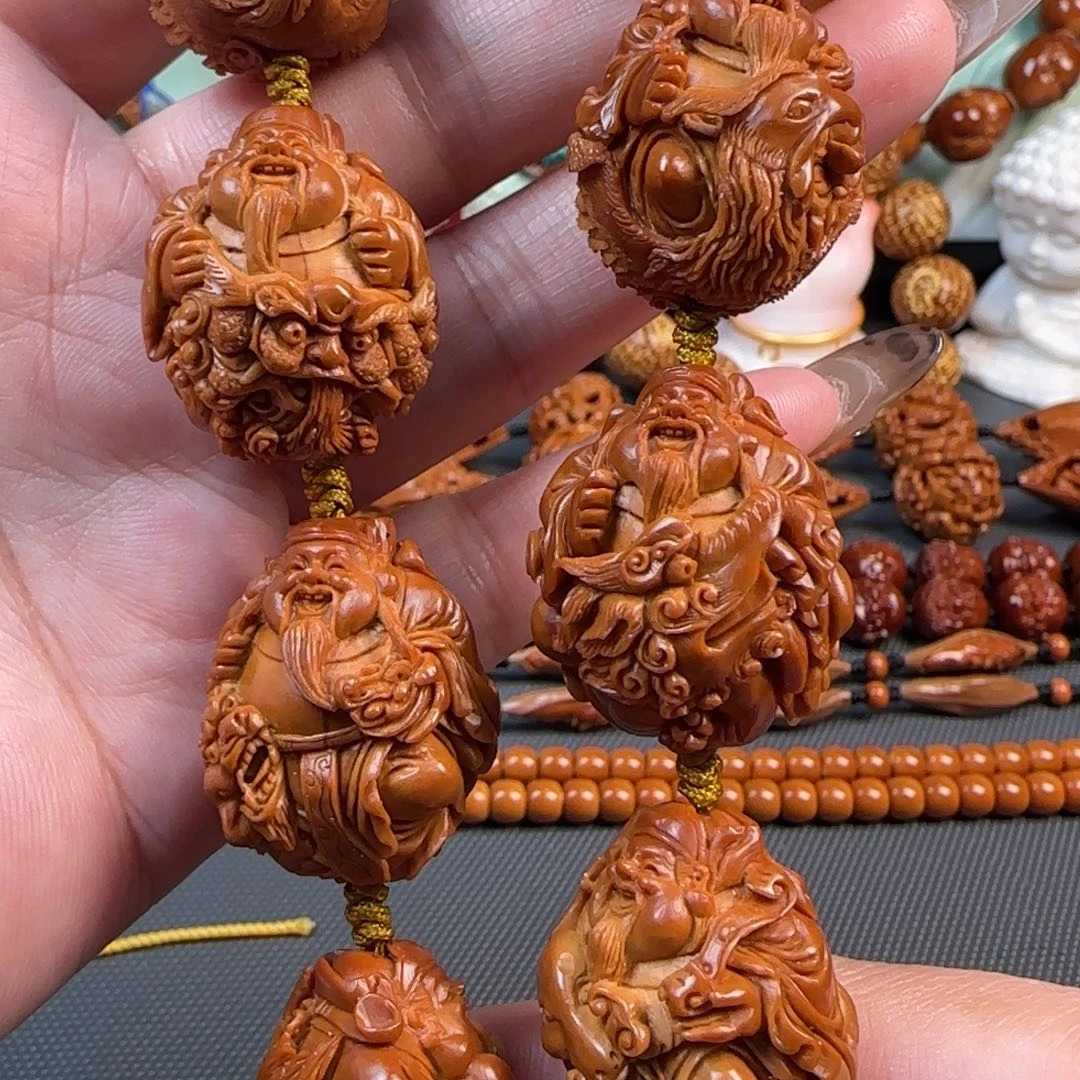 橄榄核手串/手链宽2.4梅林红核深雕骑兽财神手持