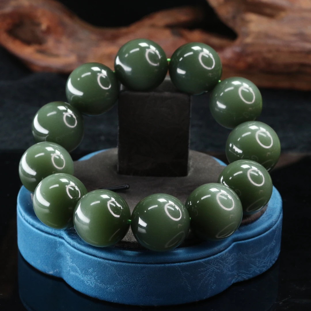 46和田玉沙枣青猫眼手串/300205上海嘉禾拍卖