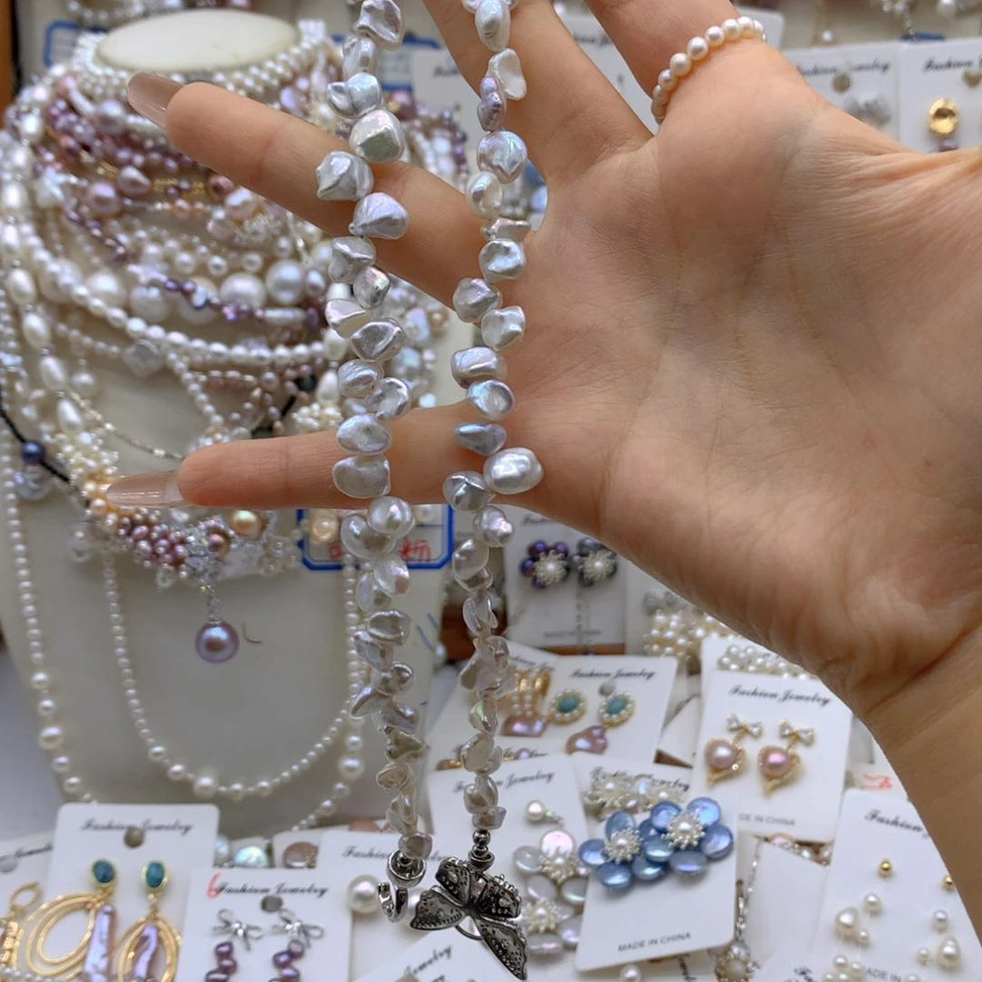 银S925镶嵌淡水珍珠耳饰长**飘