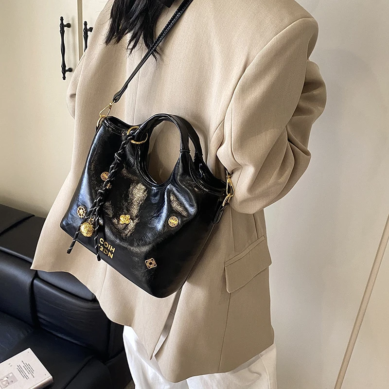 左九女包时尚手拎油蜡感水桶包女韩版ins潮单肩斜跨包2025高级感