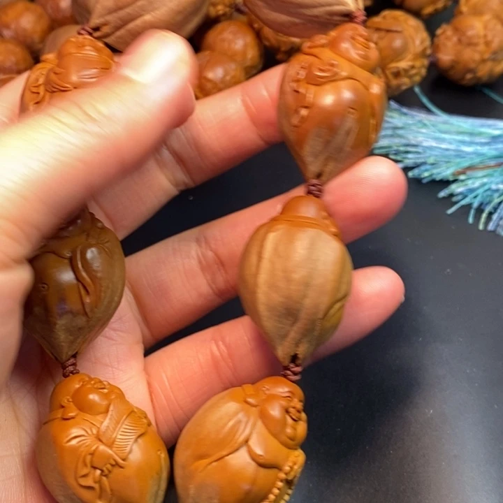 赵***军橄榄核手串/手链包衣弥勒