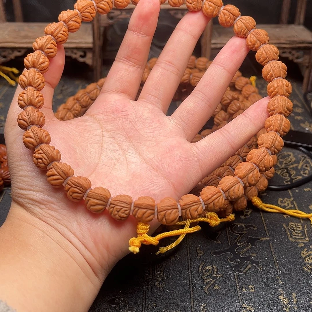 桃核吊坠赤金风雨手持