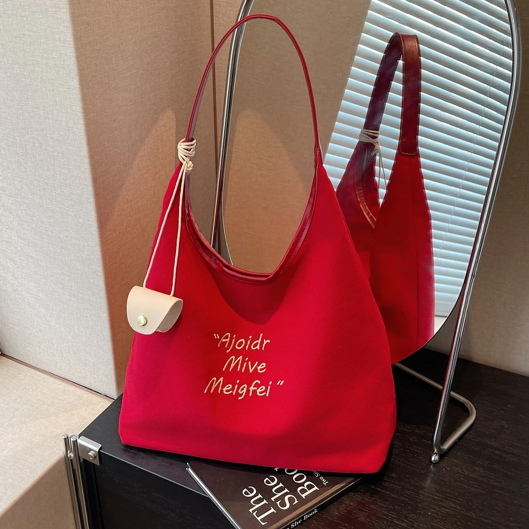 红色帆布包女2025新款韩版大容量托特包休闲通勤单肩腋下包购物袋